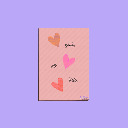 "You're My Bestie" card with pink and orange hearts on a soft pink background.