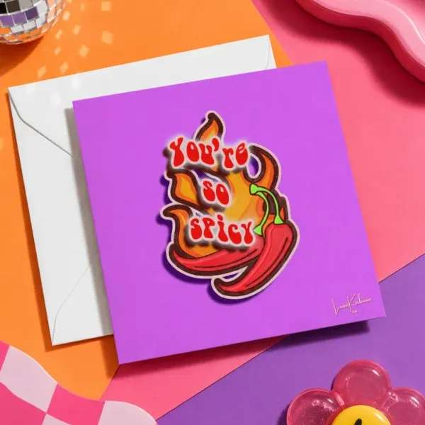 'You're So Spicy' Greeting Card flat lay on funky colourful table.