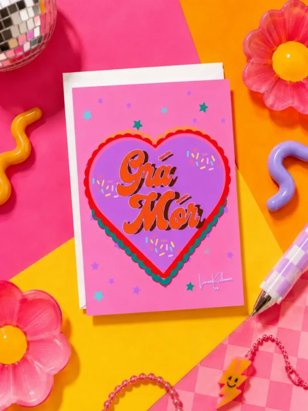 Grá Mór Card flat lay against funky colourful table
