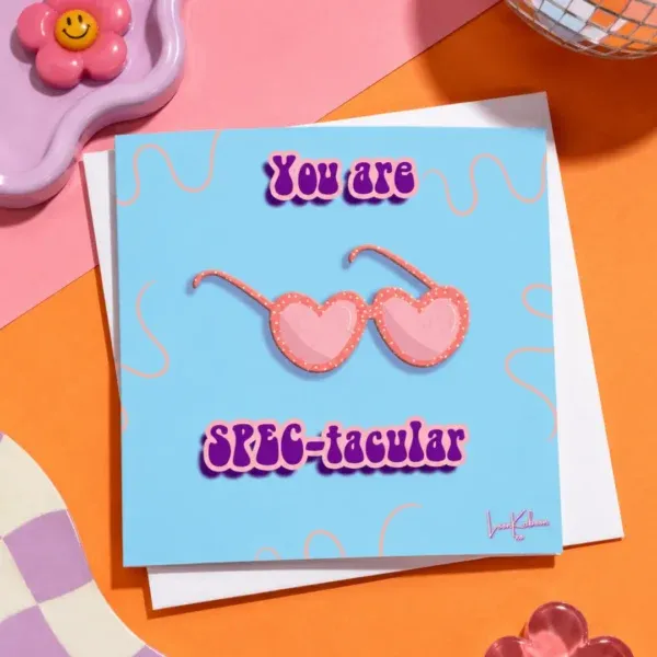 You Are Spec-tacular card flat lay on colourful table.
