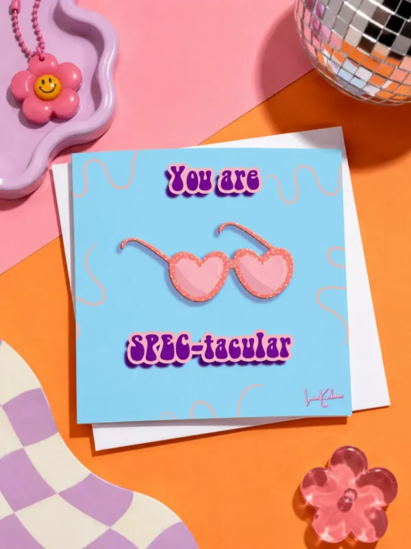 You Are Spec-tacular card flat lay on colourful table.