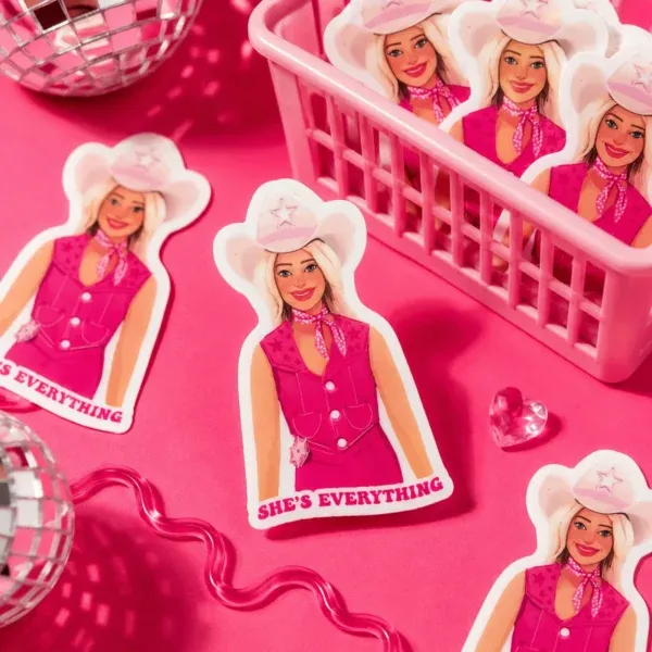 Cowboy Barbie She's Everything Sticker displayed in a cute basket and on a funky hot pink background.