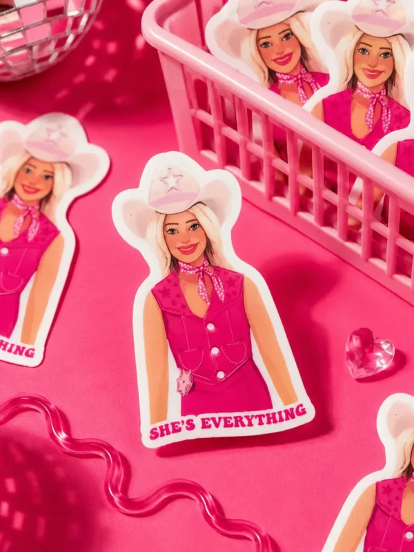 Cowboy Barbie She's Everything Sticker displayed in a cute basket and on a funky hot pink background.