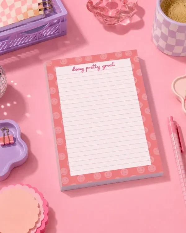 Doing Pretty Great A5 Notepad Doing Pretty Great A5 Notepad on a funky desk with pens, paperclips and other desk items.