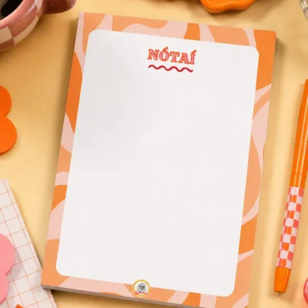 Nótaí A5 Notepad on a funky desk with pens, paperclips and other desk items.
