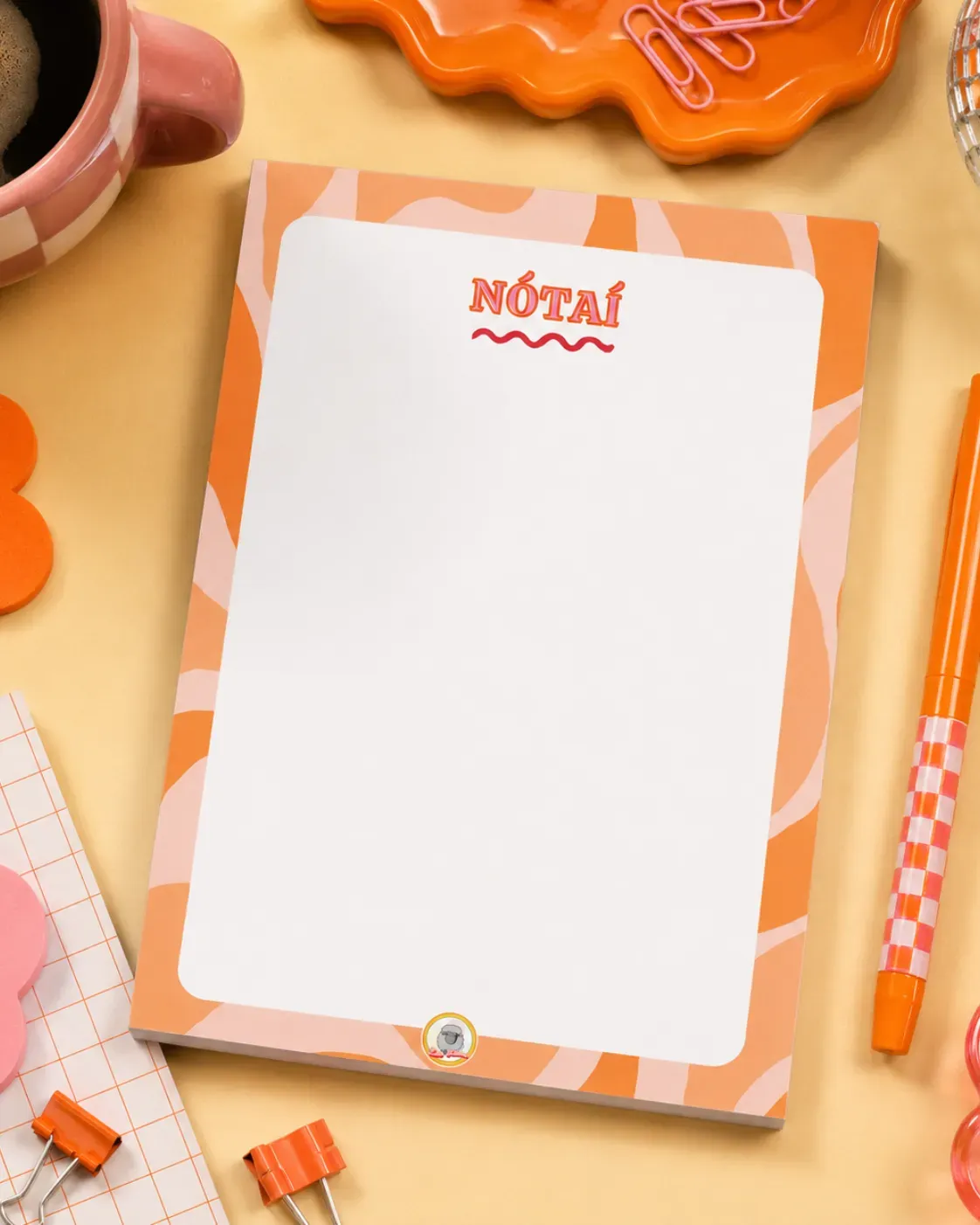 Nótaî A5 Notepad on a funky desk with pens, paperclips and other desk items.