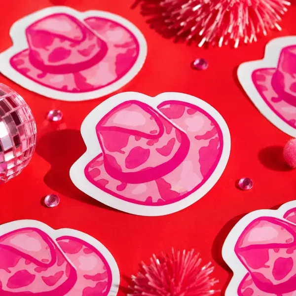 Pink Cowpal Hat Sticker Pink Cowpal Hat Sticker on funky red background with tinsel.