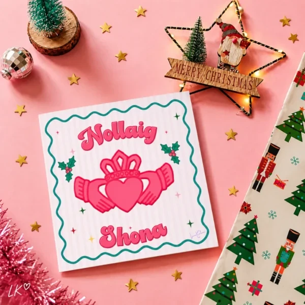 Pink Nollaig Shona Christmas card with a Claddagh illustration by Loon Kaboon