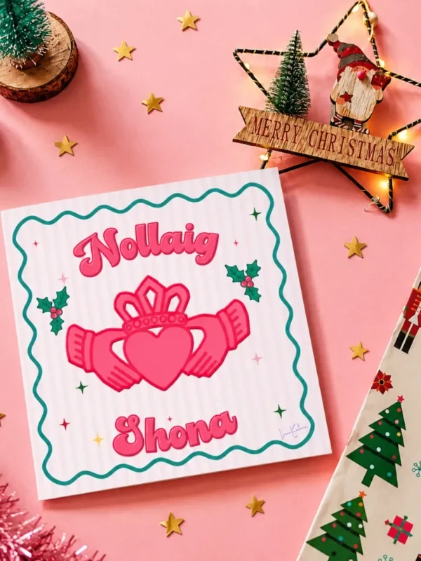 Loon Kaboon Claddagh Design Nollaig Shona Christmas Card 2026 Pink Nollaig Shona Christmas card with a Claddagh illustration by Loon Kaboon
